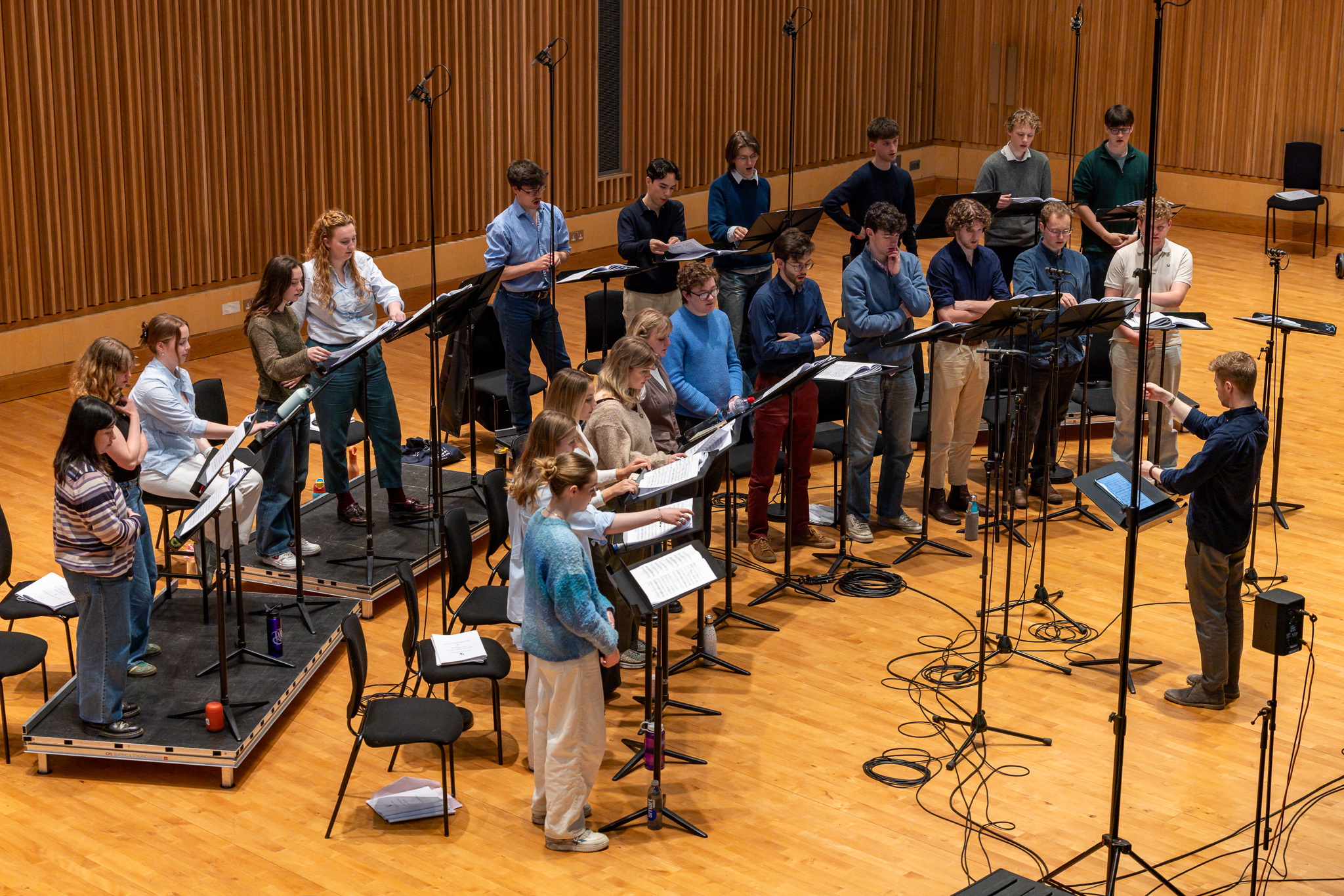 Adam Whitmore conducting The Phoenix Consort from overhead angle during recording