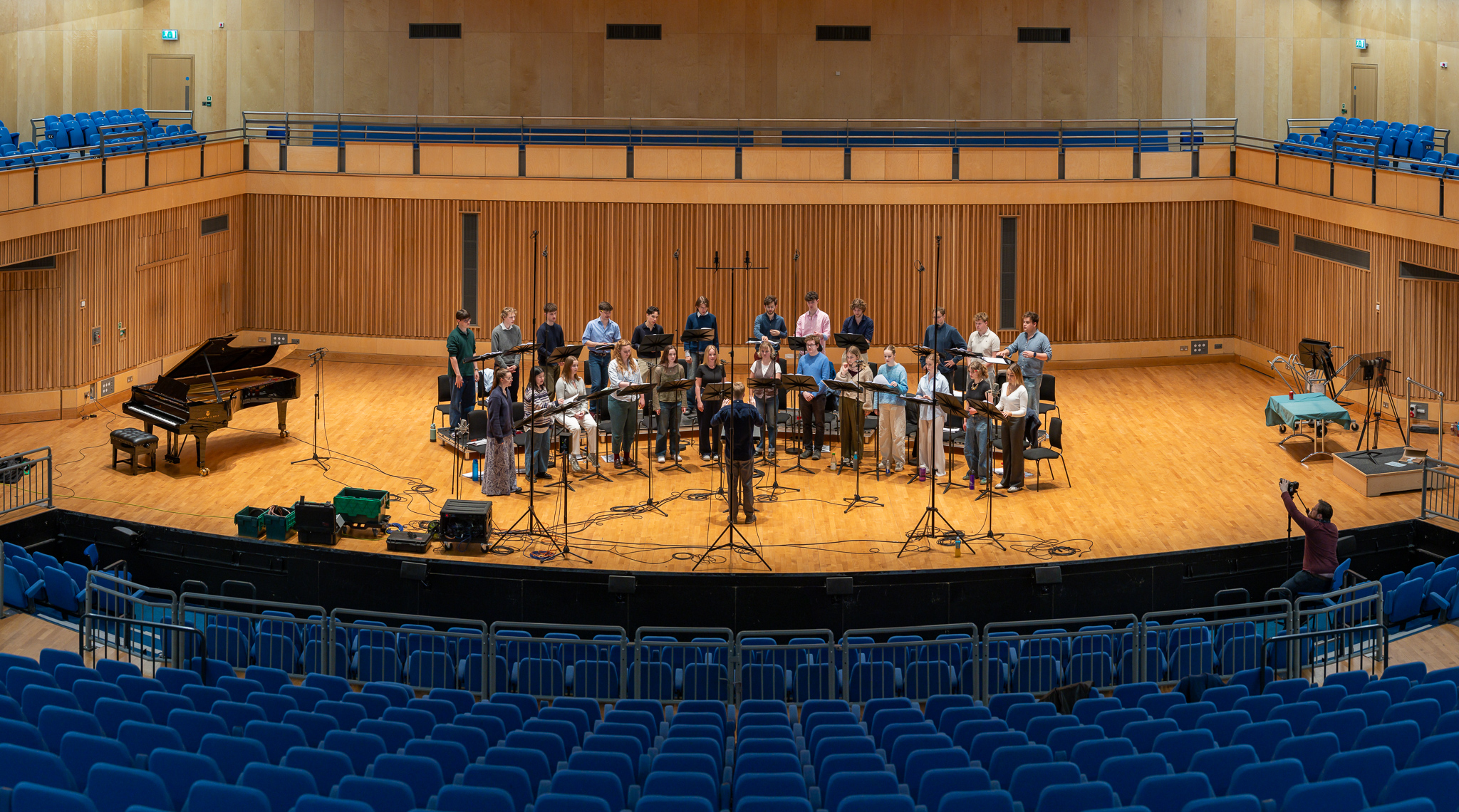 The Phoenix Consort full ensemble on stage panoramic view of concert hall